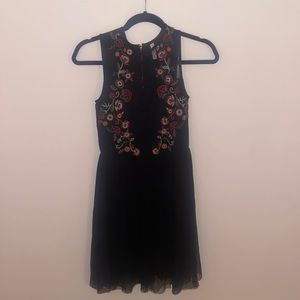Black short formal zip-up dress with red flower detailing
